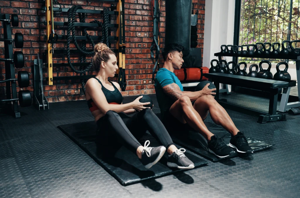 patient and physical therapist doing a core exercise together