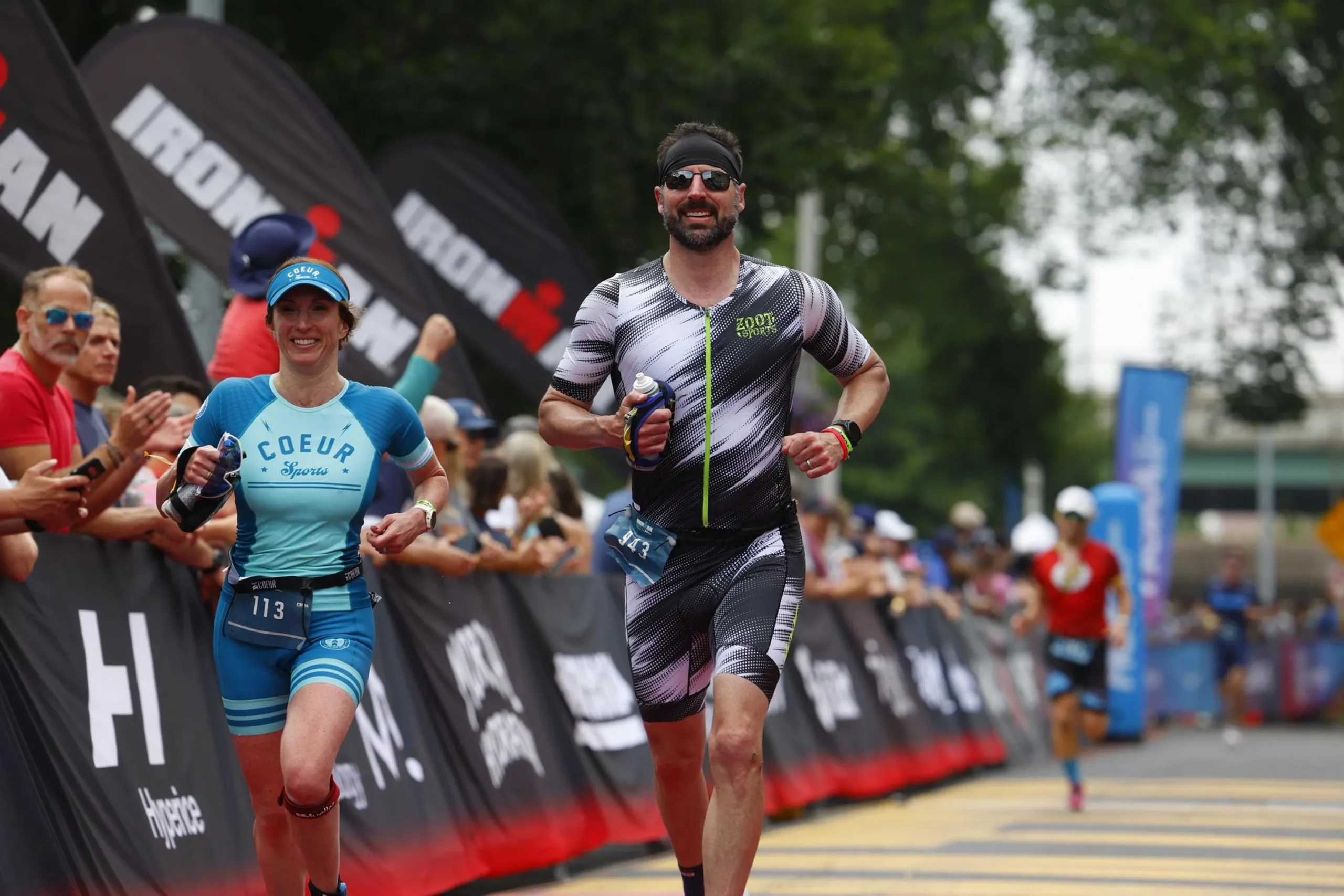 Jennifer F and another competitor in the Ironman Lake Placid Race running