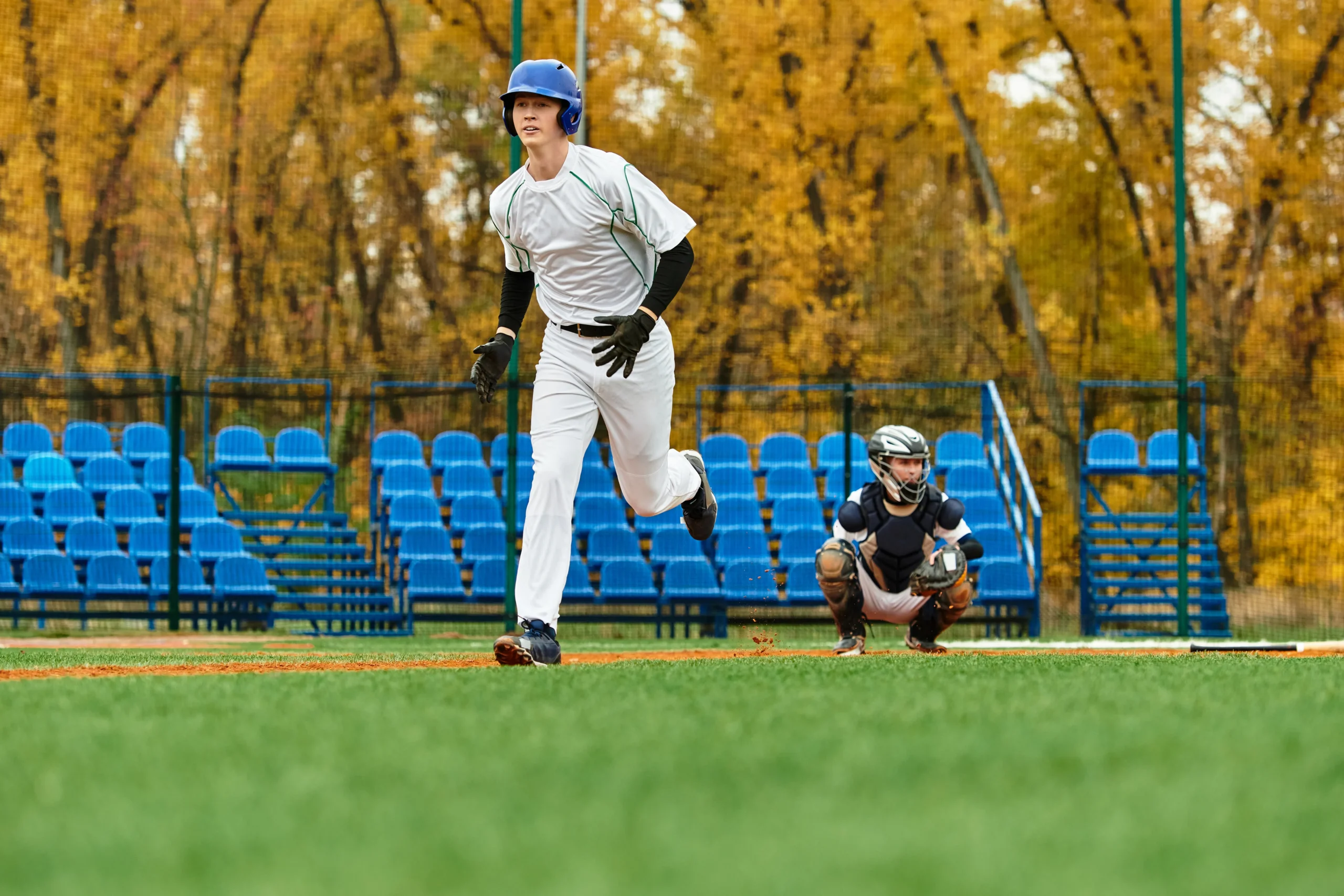 baseball player running to the next base