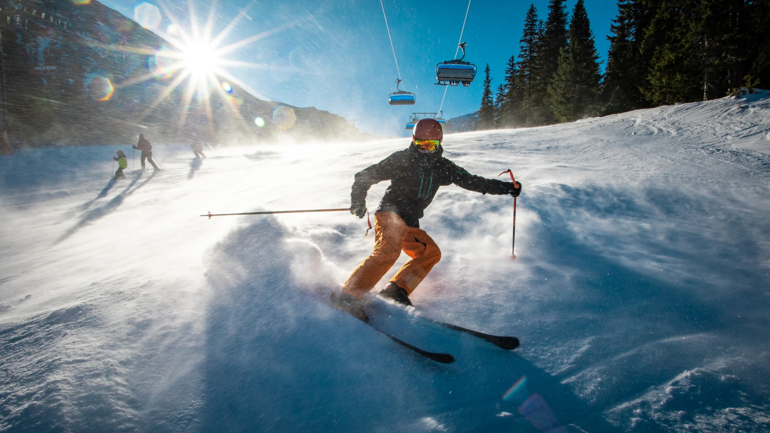 athlete going down the ski slope and swerving to the side to slow down