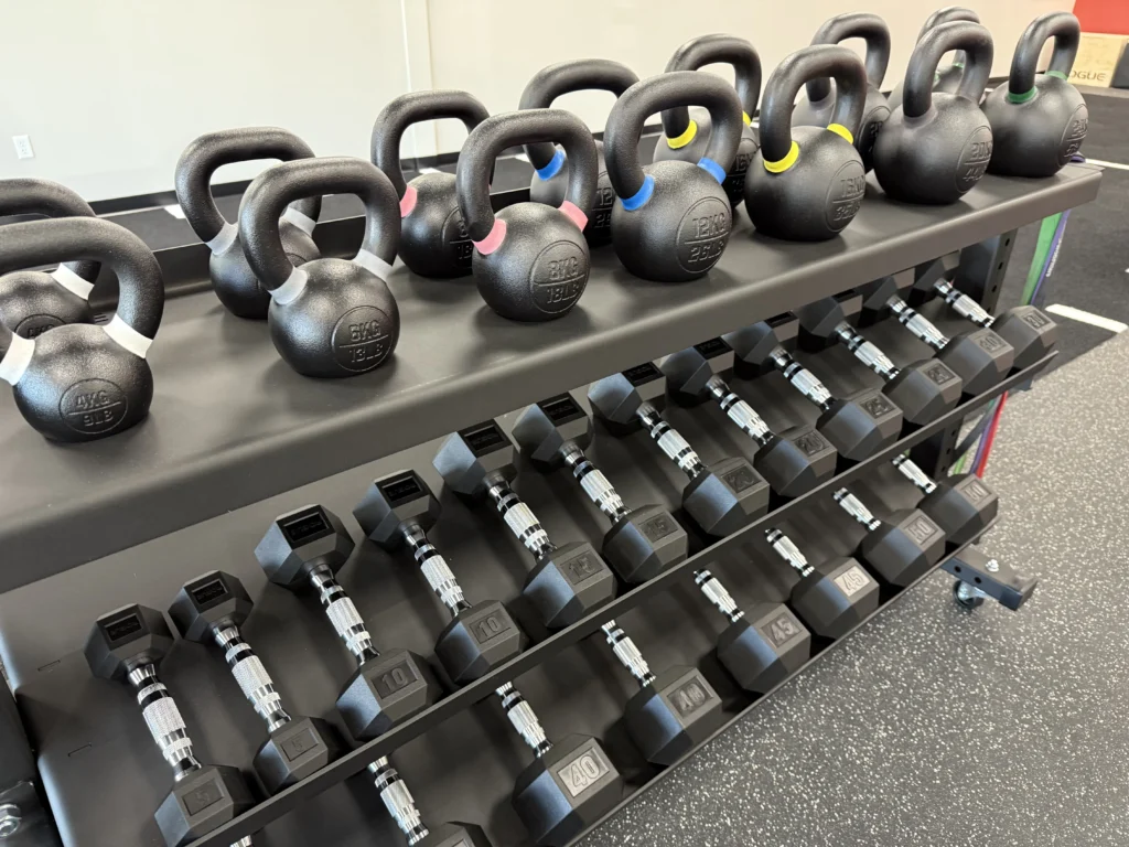 rack of kettle bells and weights inside the newly relocated Achieve PT clinic in Sudbury