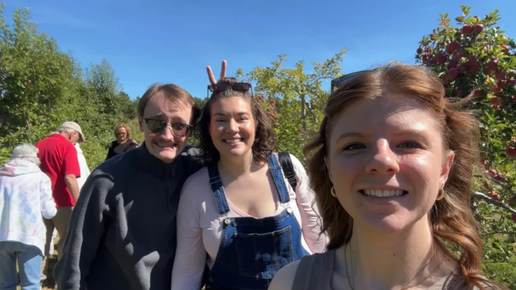 PCCs Apple Picking, trio of Achieve Physical Therapy staff smiling