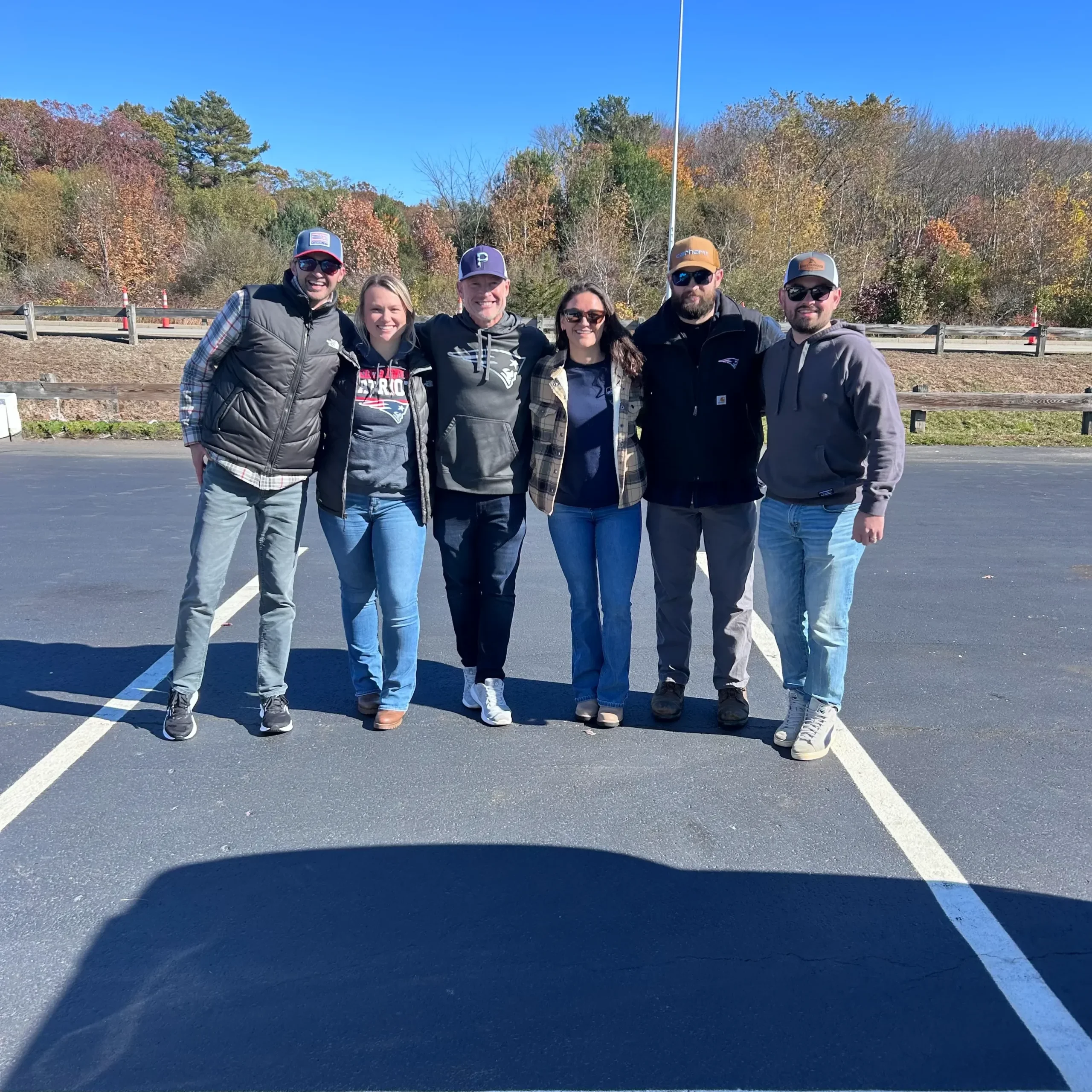 OPs Team Patriots Game Outing, group photo of staff all together and smiling