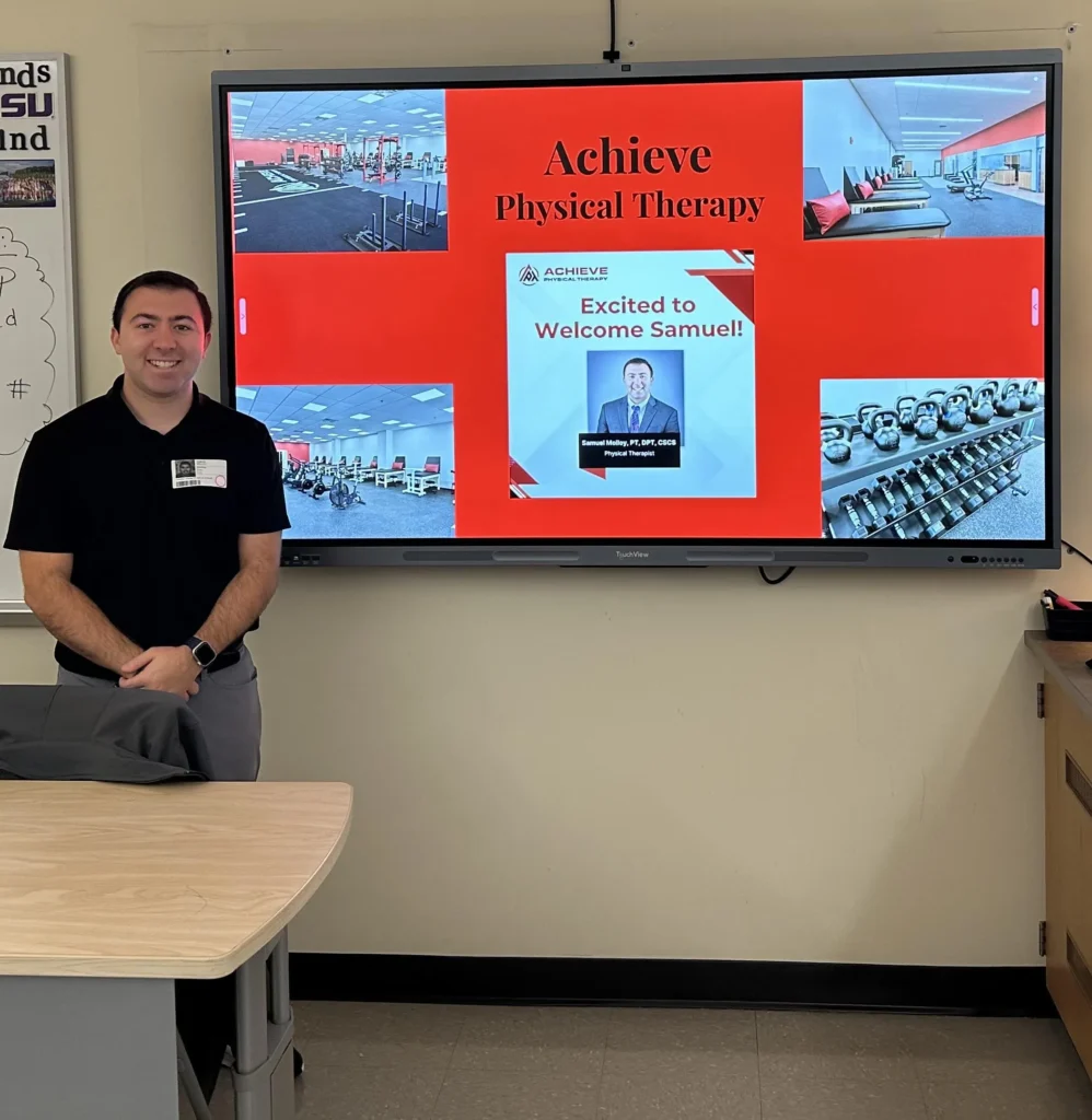 Sam doing a presentation on his PT Journey at his former high school